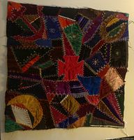 Full view of the 22-inch antique crazy quilt cushion top showing the patchwork and embroidery details.