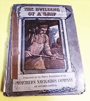 Front cover of the booklet showing a shipbuilder at work, titled 'The Building of a Ship' published by Northern Navigation Company