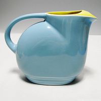 Side view of the pastel blue pitcher with chartreuse interior showing clean profile and spout.