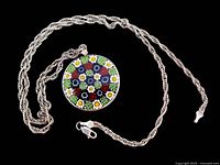 Full view of Millefiori glass pendant on twisted rope sterling silver chain, black background