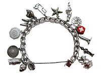 Photo of the full vintage sterling silver charm bracelet with all 14 attached charms visible, laid flat.