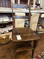 Vintage wooden step stool chair shown fully assembled, featuring a wooden backrest with slats and a wooden seat that doubles as a step.
