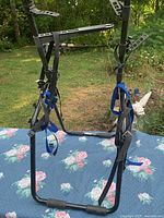 Full view of Thule trunk bike rack standing, showing frame, arms, and straps