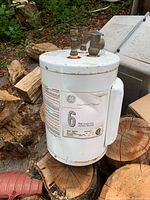 Front view showing GE SmartWater label, 6-year limited tank decal, overall exterior