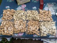 Bags of natural corks displayed on table