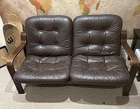 Front view of the loveseat showing full seating area and frame