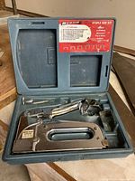 Staple gun kit in blue case with staples and metal staple gun