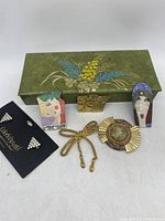 Overall view of jewelry box and all pins, showing designs and colors