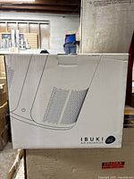 Box front showing illustration of Miko Ibuki air enhancer with aroma diffuser badge.