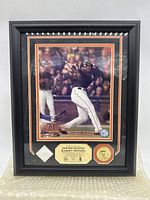 Full frontal image of framed Barry Bonds collectible showing photo, fabric swatch, and certification label.