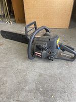 Side angle of Craftsman 18" 40cc chainsaw, showing full length of cutting bar and body condition.