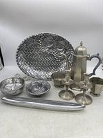 Full display of pewter items including Lenox 15-inch platter, Gorham tea kettle, cream and sugar set, candlesticks, and decorative bowls arranged on white background.