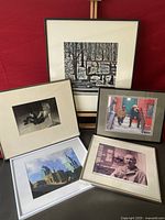 Group photo showing the five framed photographs arranged against a red background.