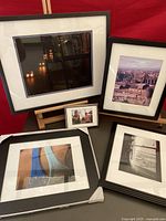 Five framed photographic artworks by Stephen Millner of varied subjects including urban and portrait scenes, displayed together.