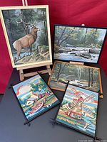 Grouping of five framed paint by numbers artworks with nature themes, showing all items together