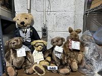 Group photo of six figures including the large groom teddy bear, three Brer bears, Brer Rabbit, and Old Time Flyer bear with goggles.