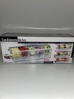 Box front showing product image with compartments filled with various fresh condiments