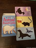 Animal stencil cards with images of animals including duck, mouse, and seal along with silhouette shapes and the Animal Stencil Cards box