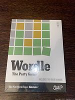 Front of sealed Wordle: The Party Game box showing the colored tile design and branding.