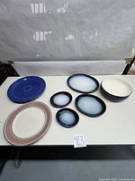 Overview of all pottery items on table showing arrangement and color schemes