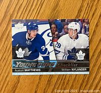 Front side of the Upper Deck Young Guns checklist card showing Auston Matthews and William Nylander in Toronto Maple Leafs uniforms.