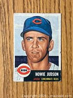 Front color illustration of Howie Judson in Cincinnati Reds cap with team logo and name details.