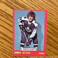 Front side of 1973-74 O-Pee-Chee Darryl Sittler hockey card with player image and team details.