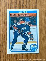 Front view of 1982-83 O-Pee-Chee Mark Messier hockey card with image of Messier in Edmonton Oilers uniform skating.