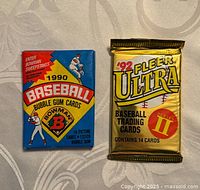 Front view of two sealed baseball card packs: 1990 Bowman and 1992 Fleer Ultra Series II