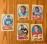 Front view of five 1970 Topps football cards showing players David Lee, Dick Westmoreland, Earl McCullouch, Dan Abramowicz, and Jon Morris in their team uniforms.