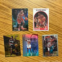 Top side of 5 different Scottie Pippen basketball cards showing front images and designs including Chicago Bulls and Portland Trail Blazers uniforms.