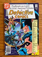 Front cover of Detective Comics #500 showing Batman, Robin, and other characters with celebration text and story credits.