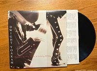 Front cover and vinyl record visible, showing artist name and album title.