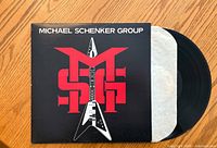 Front cover of Michael Schenker Group album featuring the MSG logo with a guitar graphic.