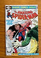 Front cover of The Amazing Spider-Man #217 with Spider-Man, Hydro-Man, and Sandman artwork.