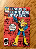 Front cover of Transformers Universe #1 comic with colorful robot and red background