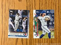 Front of two rookie baseball cards showing Vladdy Guerrero Jr. and Bo Bichette in Toronto Blue Jays uniforms.