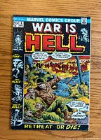 Front cover showing War Is Hell #3 with soldiers in the battlefield and bold title text