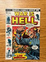 Front cover of War Is Hell #4 comic book showing colorful wartime battle scene with soldier in Nazi uniform holding grenade