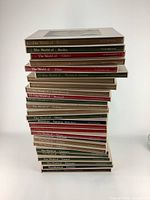 Stack of 27 hardcover vintage Time Life Library of Art books showing various titles with different colored jackets.