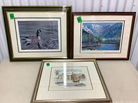Lot of 3 vintage framed nature scene art prints: goose, mountain, and winter scenes.