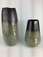 Photo showing both black and olive green gradient vases side by side, with taller vase approximately 13 inches high.