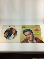 Photo showing both Elvis Presley vinyl record album covers, 'A Legendary Performer Early Years' and 'King Creole'.