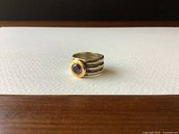 Ring front view on white background showing bezel and shank design