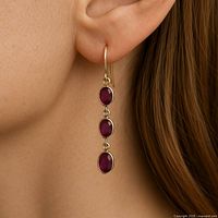 Earring worn on model’s ear, showing fit and drop length