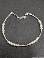 Front view of the silver bead and fresh water pearl bracelet showing the clasp and pearl details.