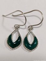 Photo of pair of silver earrings with green onyx stones, front view