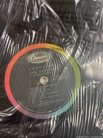 Close-up of the 'Revolver' vinyl record label showing Capitol Records logo and song titles