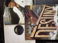 Three vinyl albums including Michael Jackson's Thriller and The Jacksons' Destiny with visible sleeve wear, and Michael Jackson's Off the Wall vinyl without sleeve.