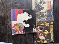 Top view of four vinyl record sleeves featuring The Animals and related bands from the 60s rock era, showing cover art with band photos and psychedelic artwork.